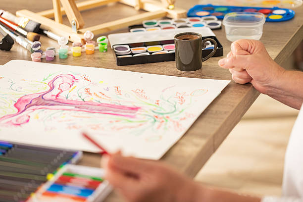istock Senior Illustrator Working on Artwork About Menopause and Balance 2243863117