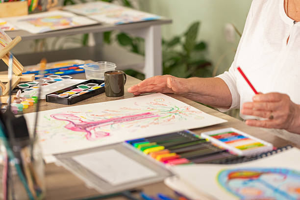 istock Senior Illustrator Working on Artwork About Menopause and Balance 2243863118