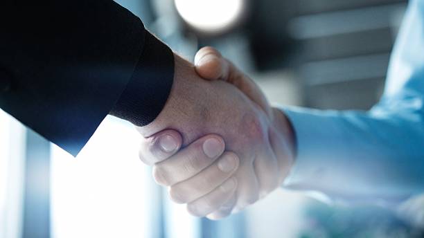 istock Partnership, teamwork and shaking hands for agreement, consulting or introduction in meeting 2243865236