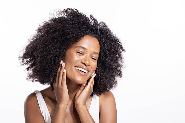 istock Beautiful young black woman posing against white background 2243867704