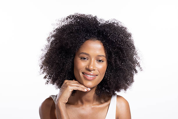 istock Beautiful young black woman posing against white background 2243867708