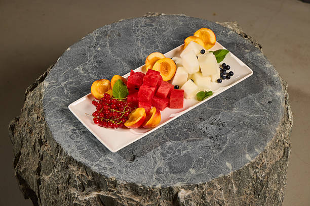 A Colorful Fruit Platter on a Beautiful Natural Stone Base Perfect for Any Occasion
