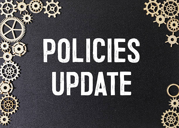 istock A black spiral bound notebook with the word Policies Update written on it. 2243870816