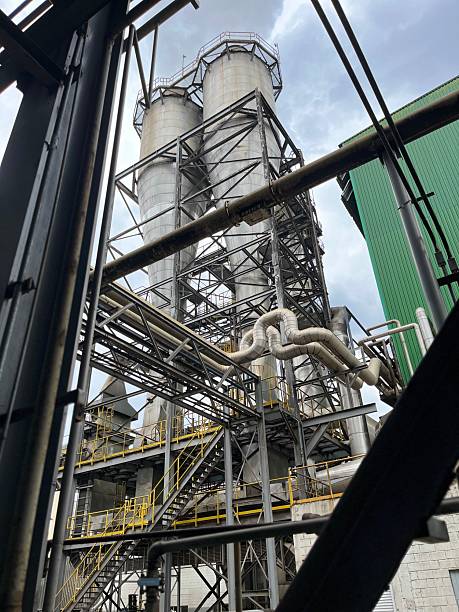 istock Industrial Chimneys Emitting Steam at Process Plant 2243873509