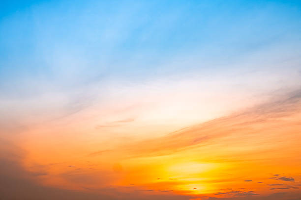 Beautiful , luxury soft gradient orange gold clouds and sunlight on the blue sky perfect for the background, take in evening,Twilight, Large size, high definition landscape photo, savanna view