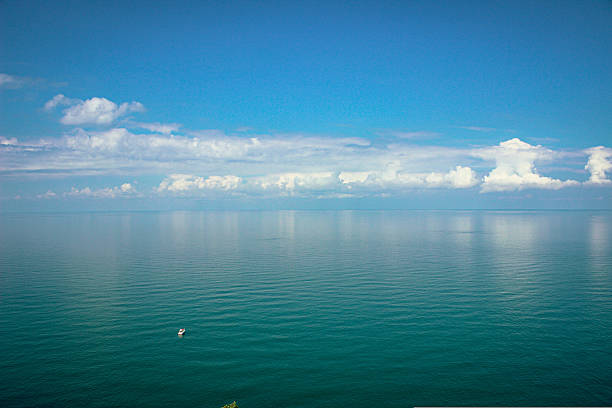 UGC Mobile Device photo of the Chicago Skyline with Soldier Field, sailboats in Burnham Park Harbor from Northerly Island on a partly cloudy summer day