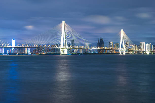 istock Modern urban waterfront skyline at night 2243879400