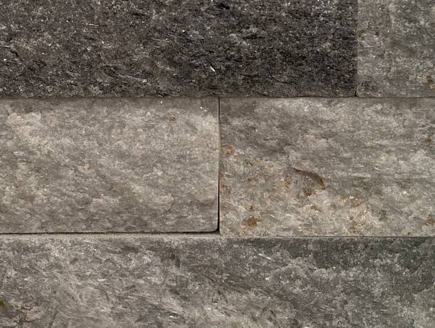 istock stone wall surface, textured grey stone wall with clean horizontal alignment and soft color tones 2243880670