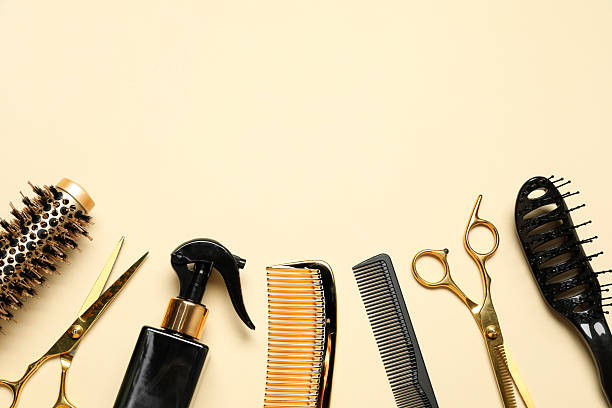 istock Different hairdresser tools on beige background, flat lay. Space for text 2243881493