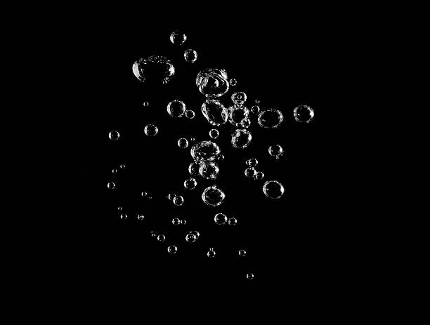 istock Clear water bubbles floating in dark background represent freshness, purity, clean air, and minimal abstract concept. Ideal for beverage, environment, and wellness branding or modern graphic design. 2243881678