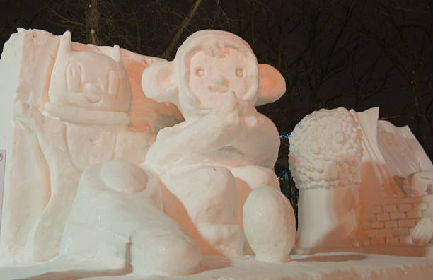 Odori Park, Sapporo, Feb 05, 2016: A medium-sized snow sculpture of cartoon characters, including a monkey, displayed at night during the Sapporo Snow Festival.