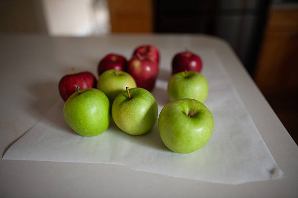 Fresh red and green apples sitting on counter in home kitchen in Grimes, Iowa, United States