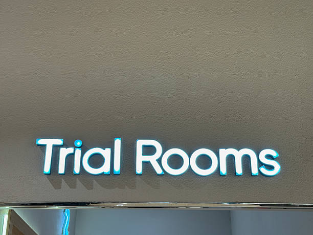 istock A sign for Trial Rooms is lit up in blue 2243889602
