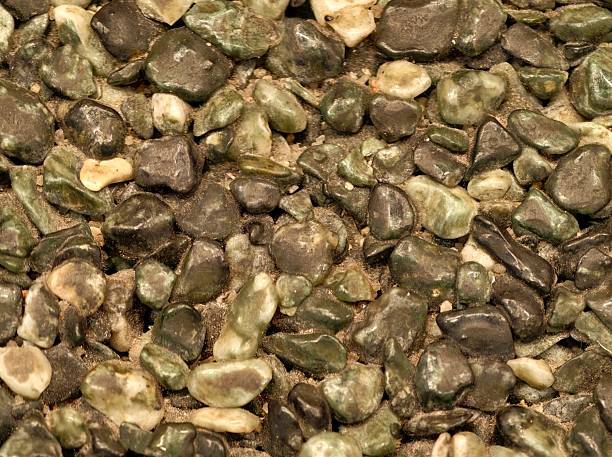 istock green stone pattern, damp pebbles with lichen, quiet mosscovered stones with subtle lichen accents 2243890242