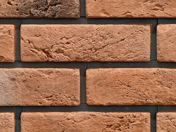 istock traditional brick facade, authentic handmade brick with earthy terracotta hues and rough mortar 2243890472