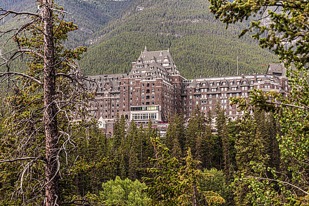 Banff, Canada - July 24, 2025: Opened in 1888 by Canadian Pacific Railway, the Fairmont Banff Spring (formerly known as Banff Springs Hotel) is a premier railway hotel that remains a historic landmark and a famous tourism site.