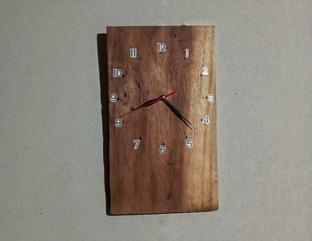 Handcrafted Wooden Wall Clock with Minimalist Design on Brown Background