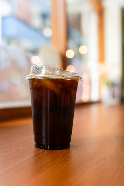istock Take out iced black coffee at coffee shop 2243897119