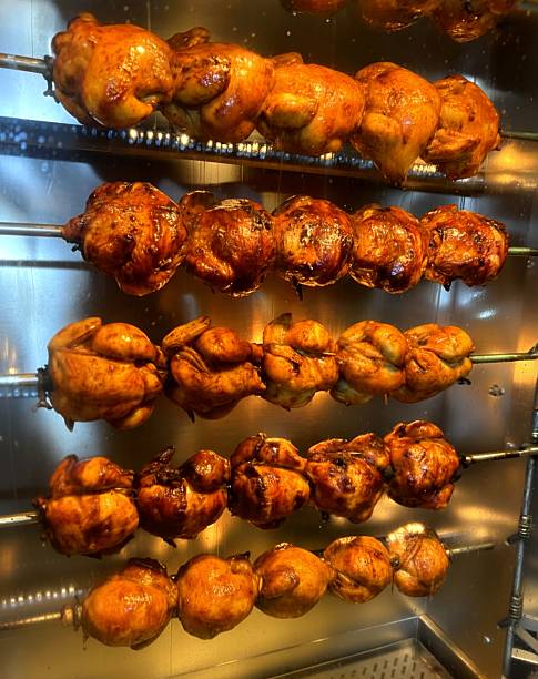 whole roast chicken in the oven. the making of roasted chicken.