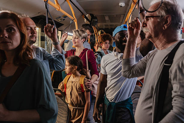 istock Diverse people commuting everyday life on crowded public bus 2243904460
