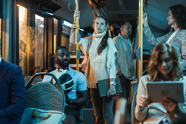 istock Diverse passengers commuting by public bus at night 2243904481