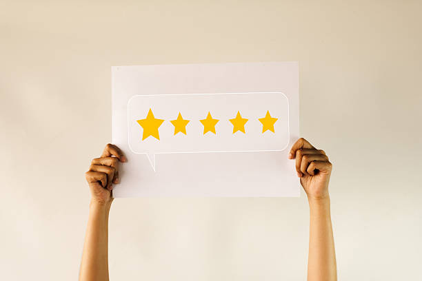 Customer Satisfaction: Hands Holding Excellent 5 Star Rating Sign