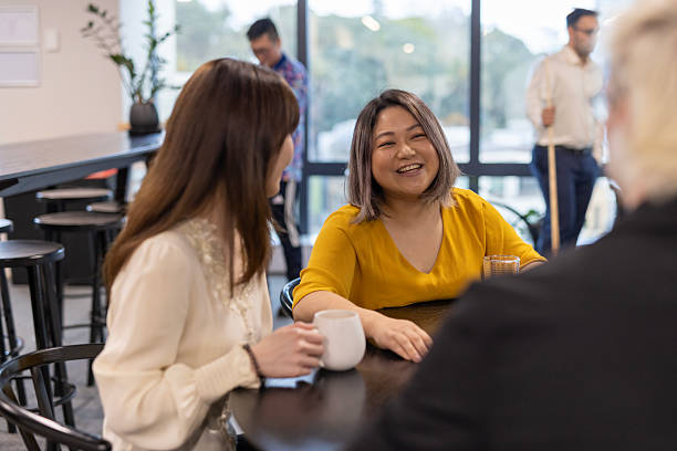 istock Happy colleagues talking together at after work drinks 2243907874