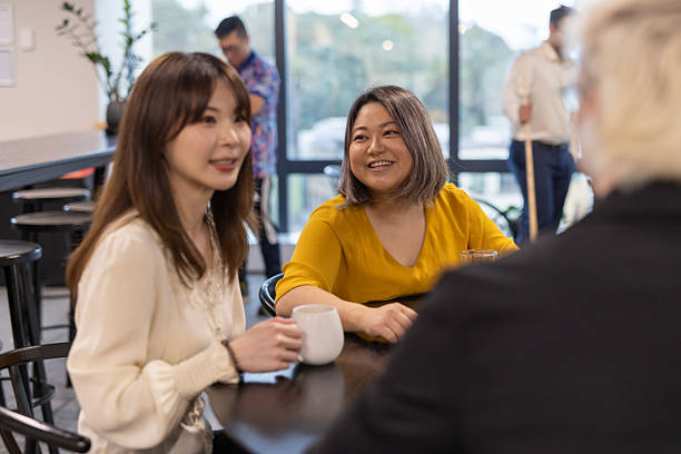 istock Happy colleagues talking together at after work drinks 2243907883