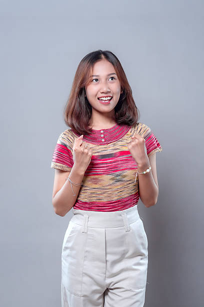 istock Excited Young Asian Woman Smiling with Joyful Expression 2243912694