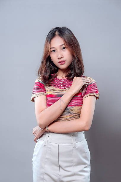 istock Confident Asian woman posing with elegance and modern style 2243913103