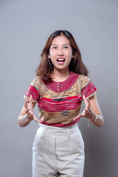 istock Angry Asian Woman Shouting in Frustration 2243913240