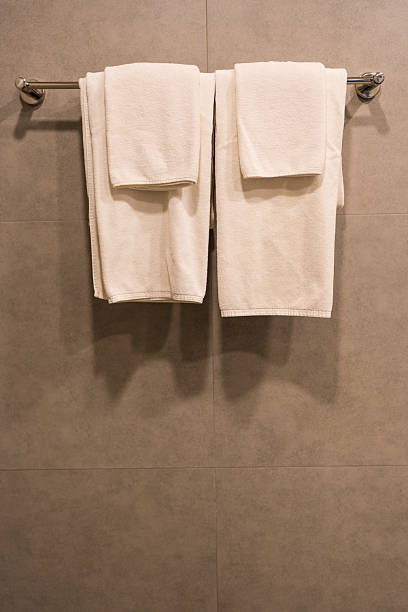 istock Minimalist silver metallic towel rack hanging fixture. 2243914844