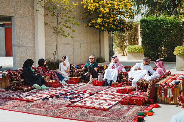 istock Diverse Group of Middle Eastern Adults Conversing in Outdoor Majlis Setting 2243916961
