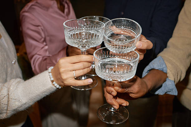 istock Diverse Group of Young Adults Toasting with Glasses during Celebration 2243918324