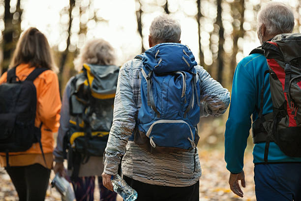 istock Group of mature hiking through a forest. 2243919165