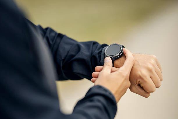 istock Man checking smart fitness watch while exercising 2243919739