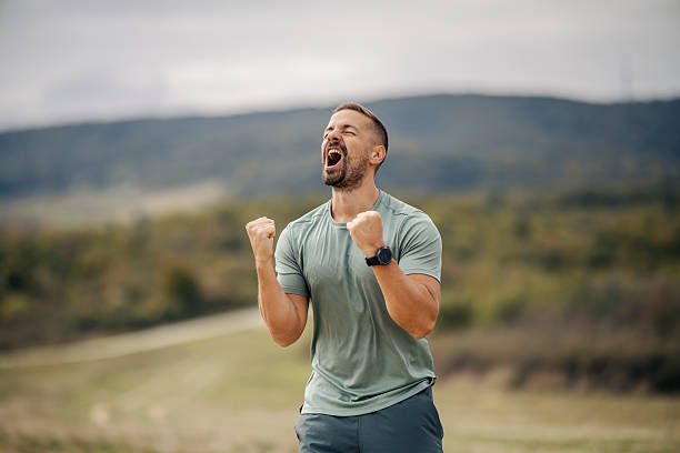 istock Man cheering expressing victory and success outdoors 2243919908