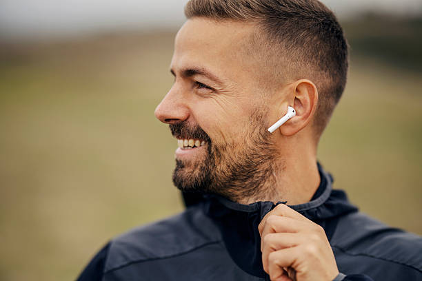 istock Man enjoying music while running outdoors 2243919998