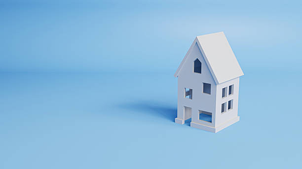 istock Minimal style house on a blue background with copy space, symbolizing home buying, housing loans, and modern living concepts. 3d rendering 2243920072