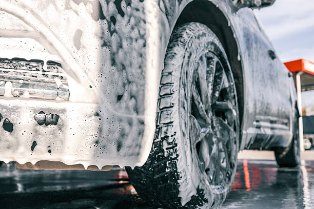 istock Car being washed with foamy soap at a car wash 2243924732