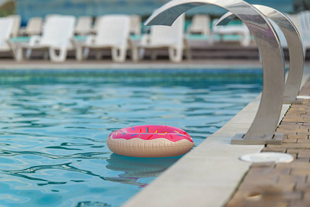 istock Donut-shaped inflatable floating in a swimming pool on a sunny day 2243924848