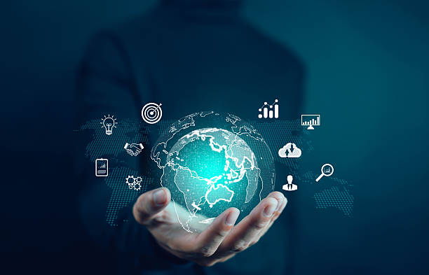 istock A businessman holding a glowing digital globe with icons of data analytics, global network, and technology innovation, symbolizing business growth and digital transformation. 2243925270