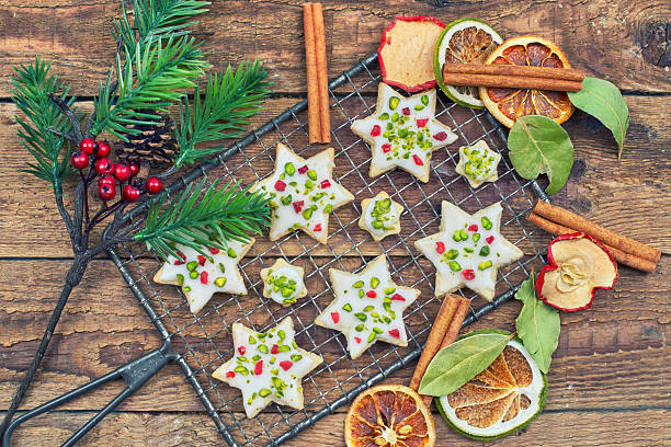 delicious Christmas cookies on a rustic wooden board with christmas decoration