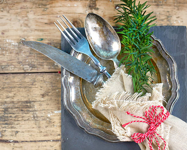 istock Christmas Cutlery Elegance on Rustic Wooden Table 2243928578