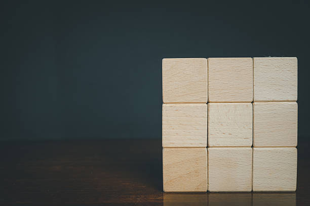 istock Template Concept: Nine Blank Wooden Blocks on Dark Background with copyspace. 2243928909