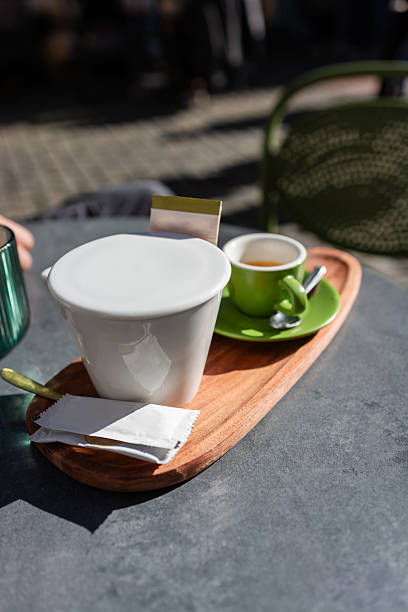 Coffee and tea on table at outdoor cafe