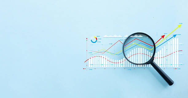 istock Business Data Analysis: Magnifier Focusing on Digital Financial Growth Chart with copyspace or freespace. 2243930903