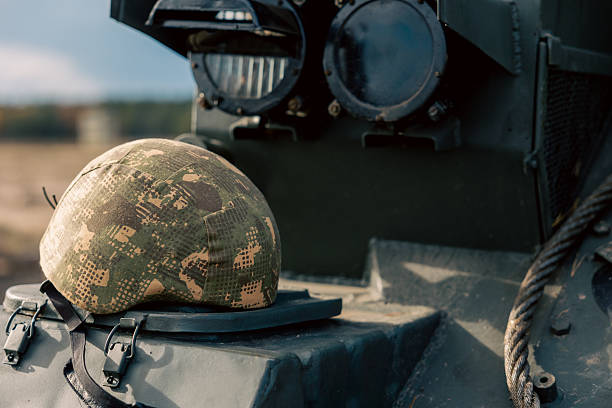 The helmet is lying on the anti-aircraft gun close up