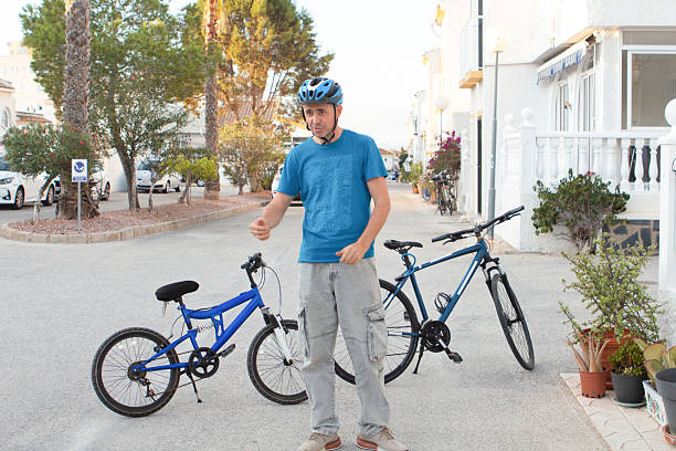 A man planning a bike ride invites his son to go cycling together