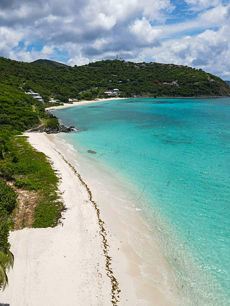 istock Tropical Beach with Clear Blue Water and Hills 2243933184